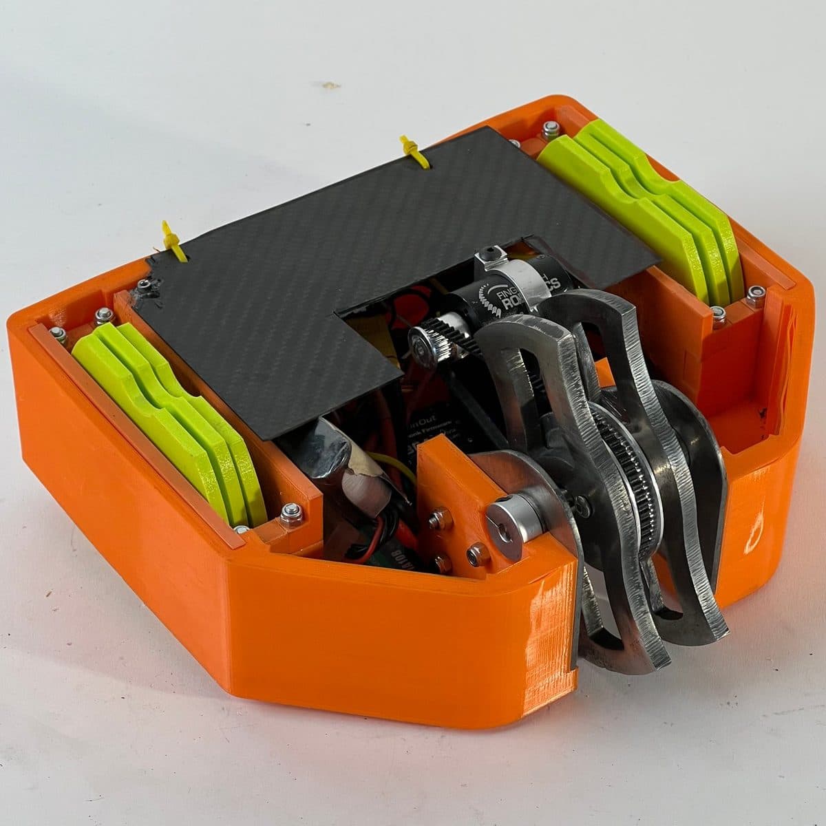 Melvin V5 — orange TPU chassis, shufflers + AR500 blades
